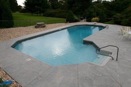Custom True L Roman Inground Pool installed by Cypress Pools