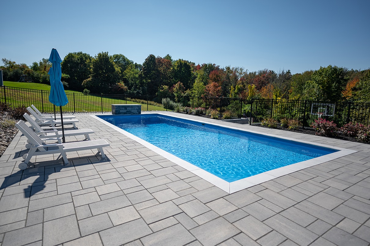 Inground Fiberglass pool with benches installed in Rensselear New York and built by Cypress Pools and Spas