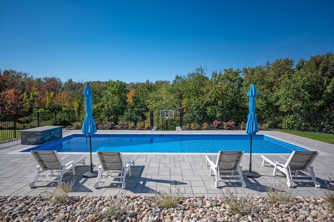 Inground Fiberglass pool with benches installed in Rensselear New York and built by Cypress Pools and Spas